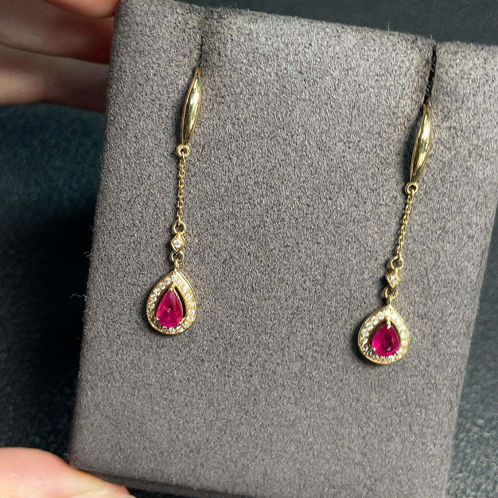 Ruby earrings with diamond accents, filled, gold content Au73%, total weight approximately 2.16g