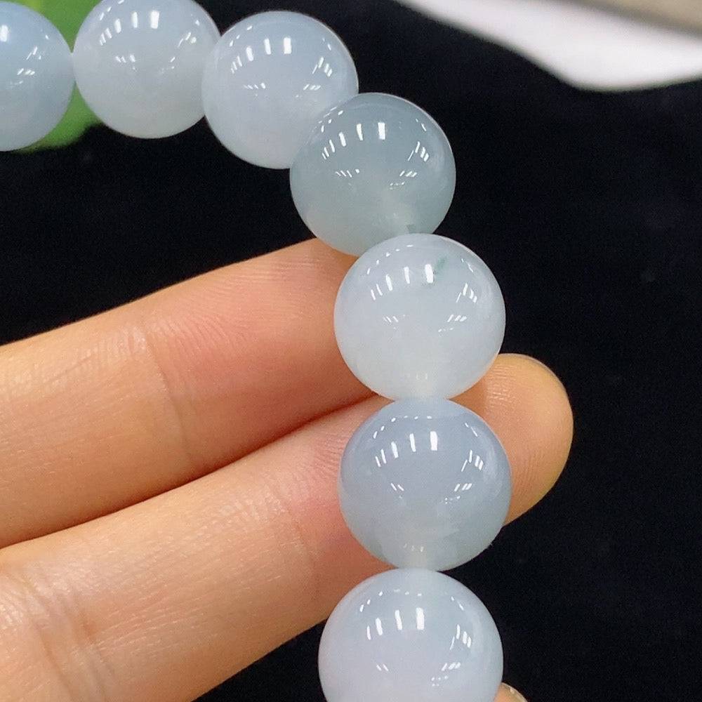 HUILIU HQ jadeite bracelet with 12.1mm beads, approximately 51g, showcasing smooth, polished jade stones in an elegant design.