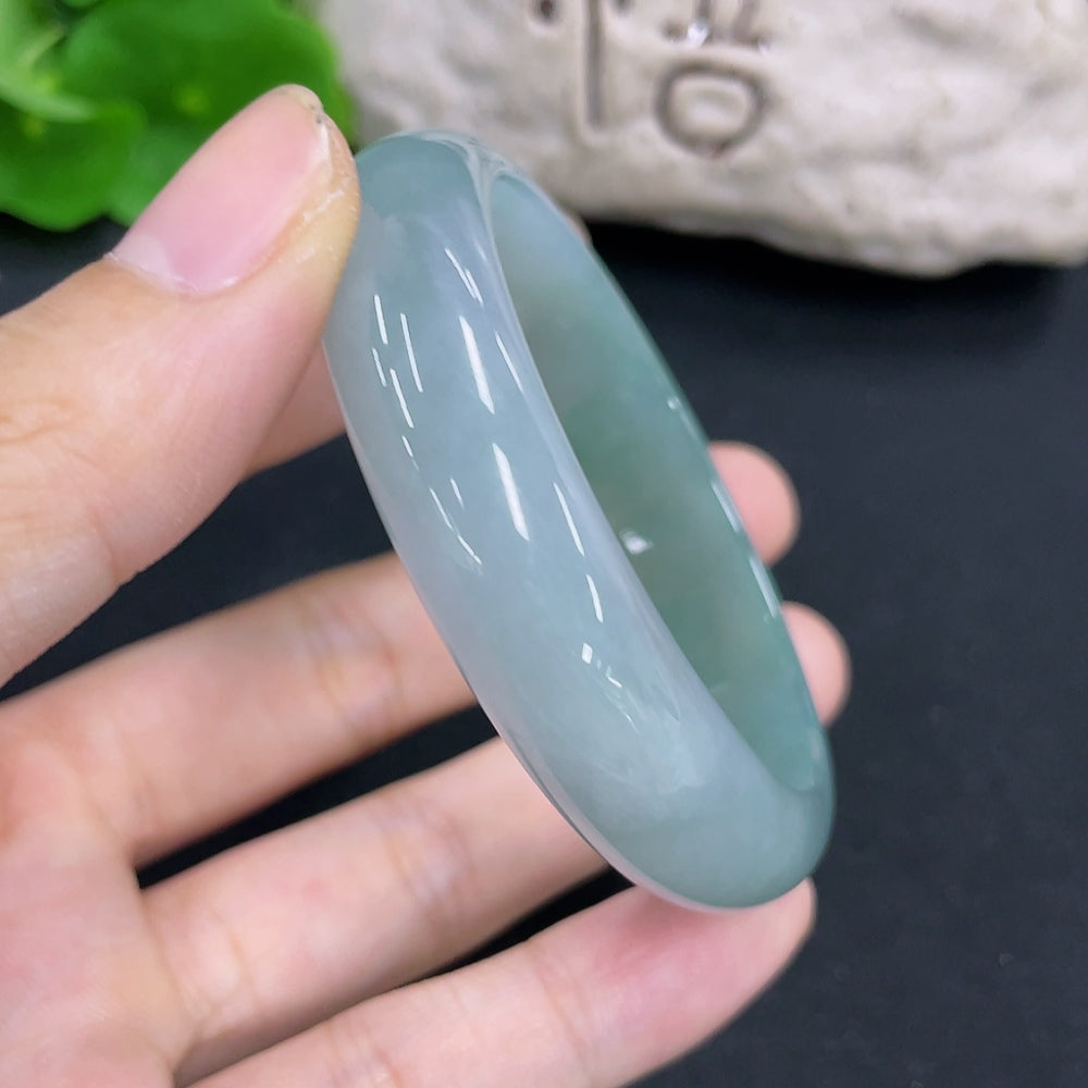 HKHQ jadeite Noble Consort bracelet with intricate design, weighs approximately 41.1g, sizes 55.5 and 49, featuring vibrant green jadeite.