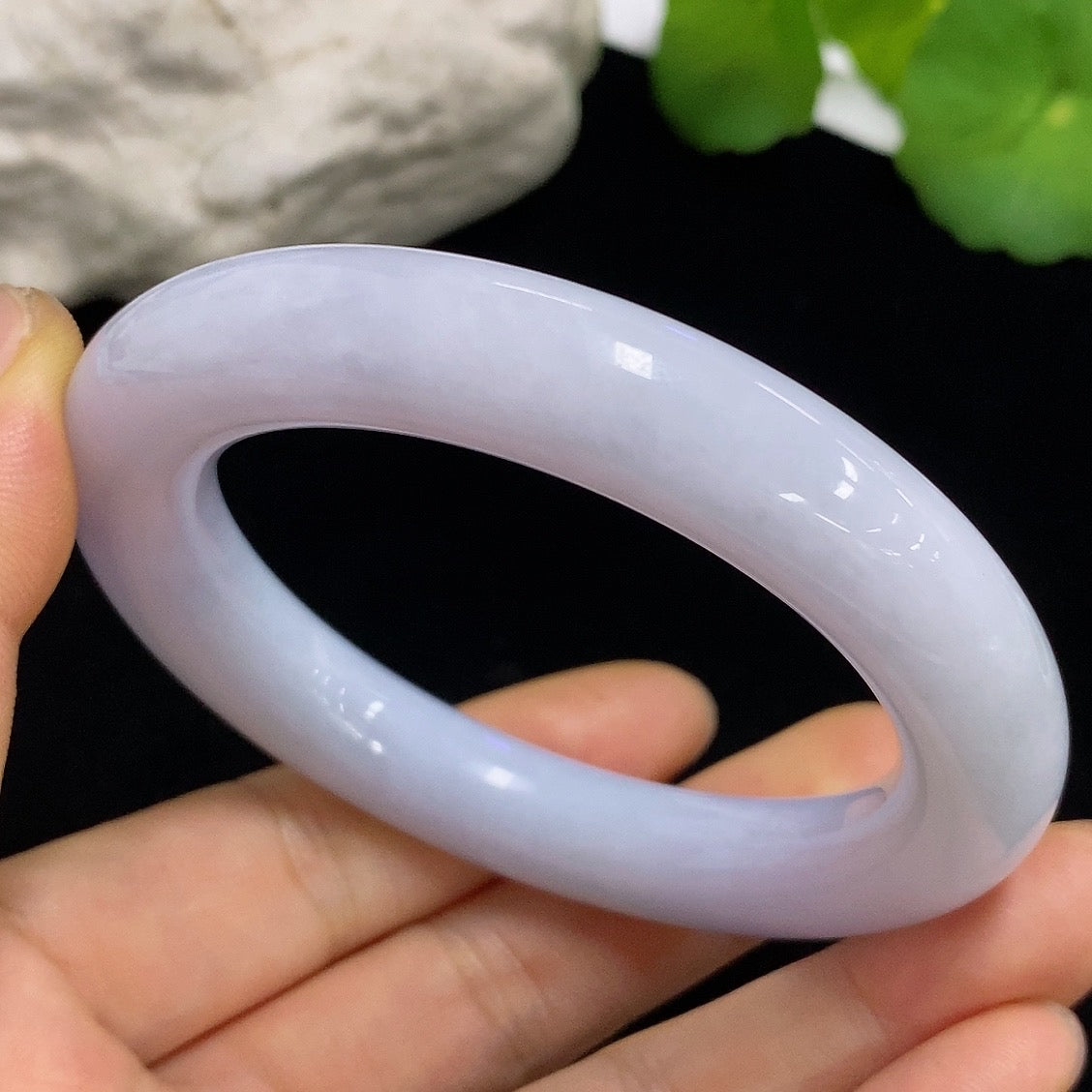 HKHQ jadeite round bangle, size 54.5, 71.4g, showcasing smooth, polished green jadeite bracelet on a neutral background.