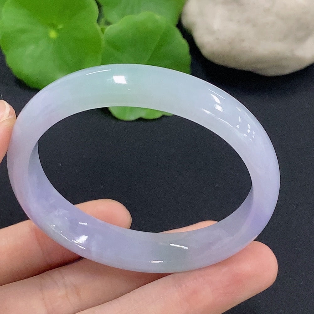 Jadeite oval bangle bracelet in size 50.2, weighing 33.7g, featuring smooth, polished jadeite with a glossy finish.