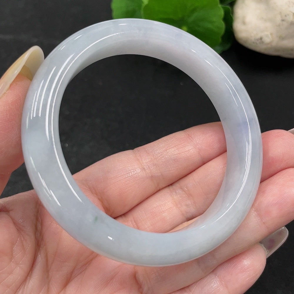 Jadeite round bangle in size 55.7 with a weight of 57.52g, crafted by HUILIU HQ, showcasing smooth, polished jade surface.
