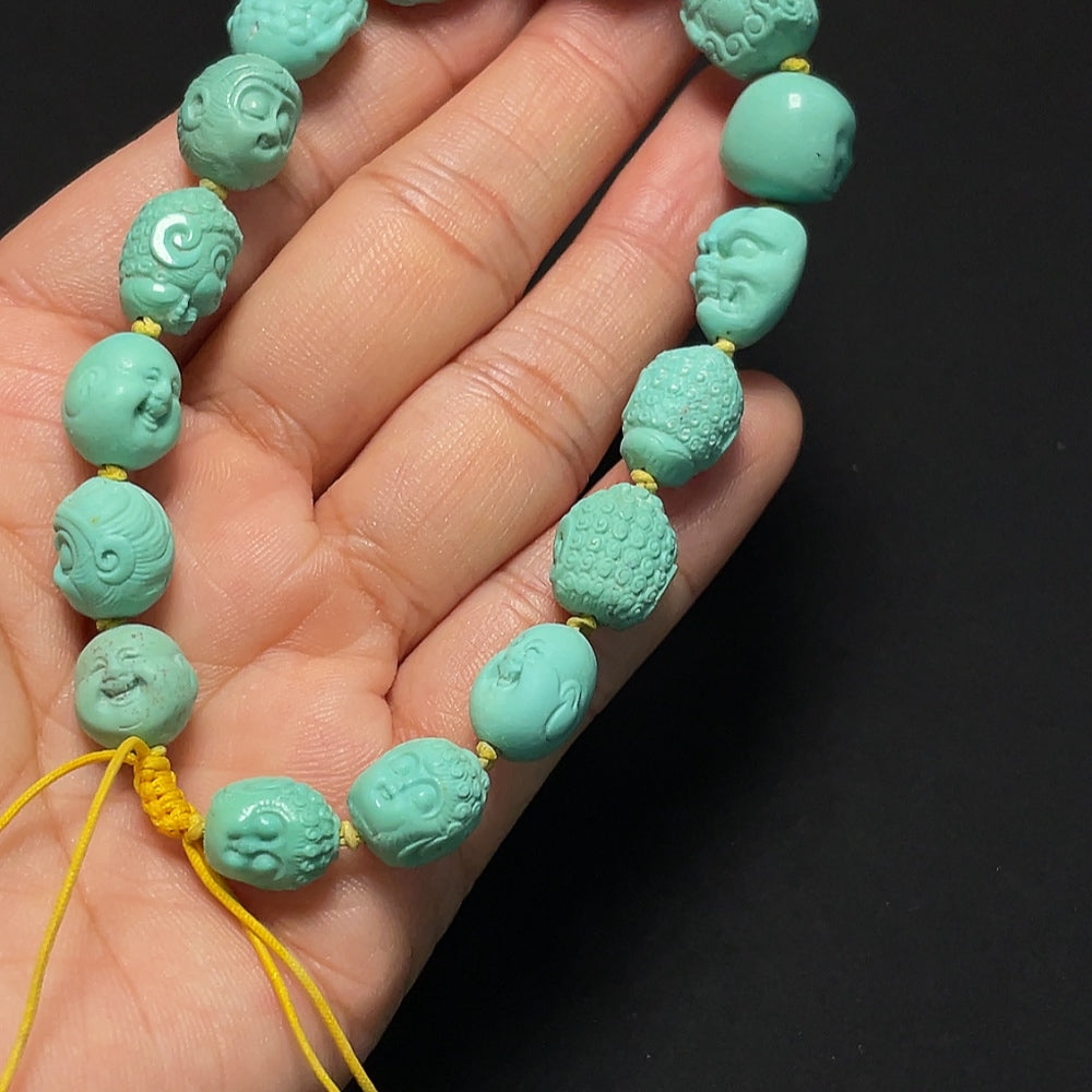 Turquoise bracelet from HKHQ featuring round beads and a silver clasp, displayed on a neutral background.