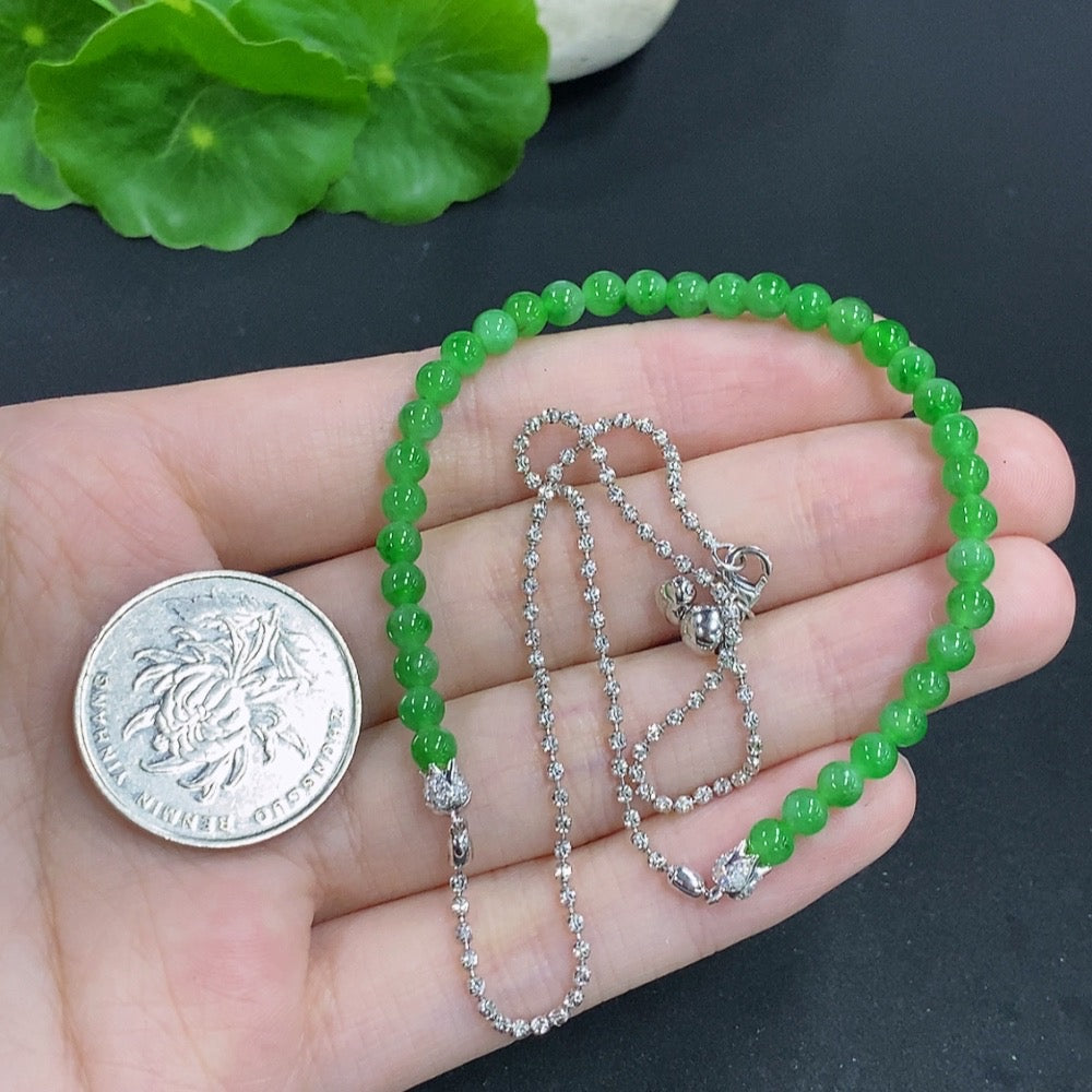 Jadeite single bezel pendant with 18k gold setting, accented with diamonds, 3.9mm size, weight approx. 8.1g including chain.