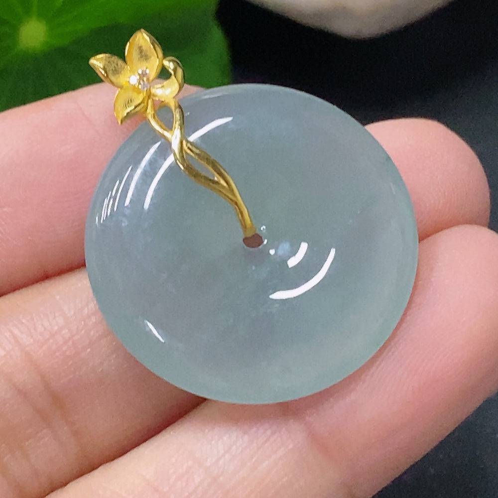 Jadeite pendant with peace knot design, 18K gold accents, diamond details, crafted by HUILIU HQ, weighs approximately 6.05g.