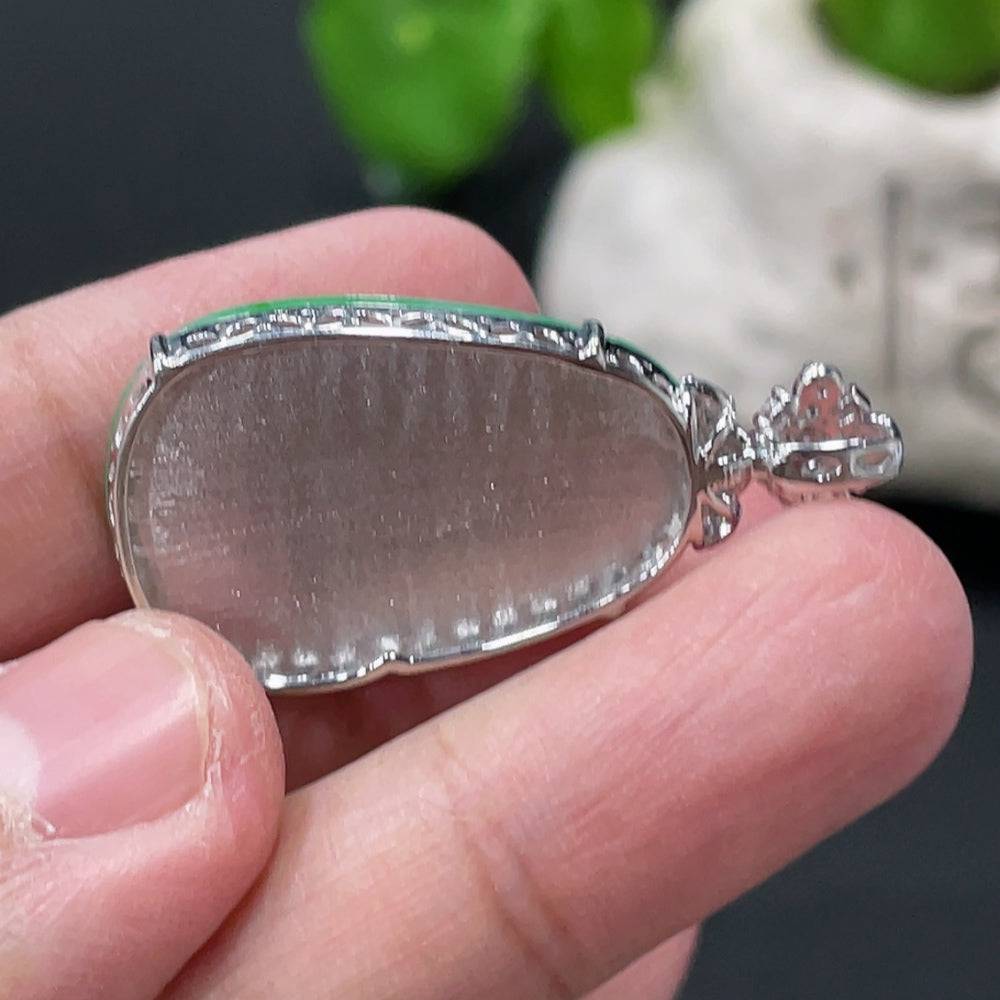 Jadeite Ruyi pendant with 18K gold and diamond accents, showcasing intricate inlaid jade design and elegant craftsmanship.