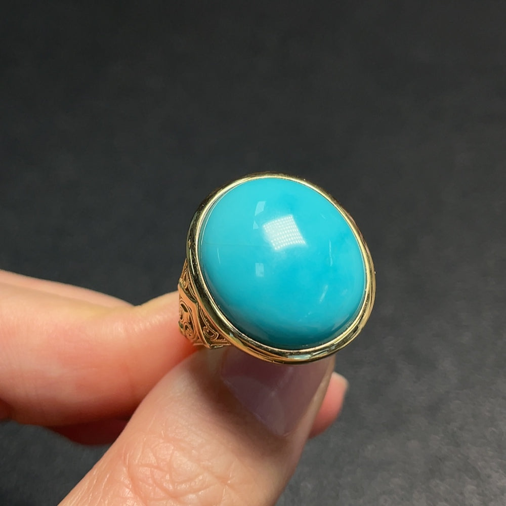 Huiliu gemstone turquoise ring with no hallmark, featuring a smooth, rounded turquoise gemstone set in a simple band.