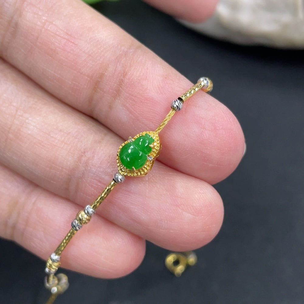 Jadeite gourd bracelet with 18k gold inlay and diamond accents, crafted by HKHQ, featuring a delicate and elegant design.