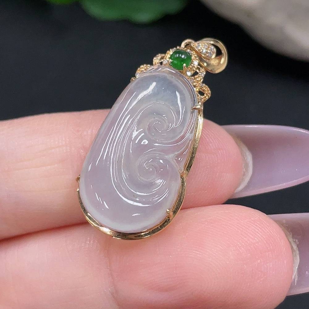 Jadeite Ruyi pendant with 18K gold and diamond accents, showcasing intricate inlay work and elegant craftsmanship.