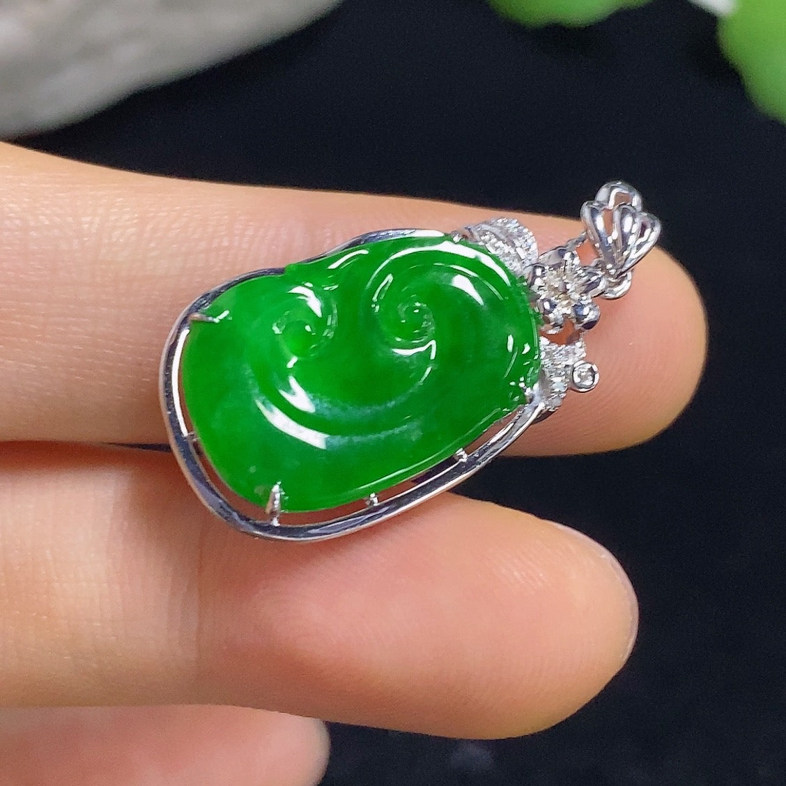Jadeite Ruyi pendant with 18k gold inlay and diamond accents, showcasing intricate design and elegant craftsmanship.