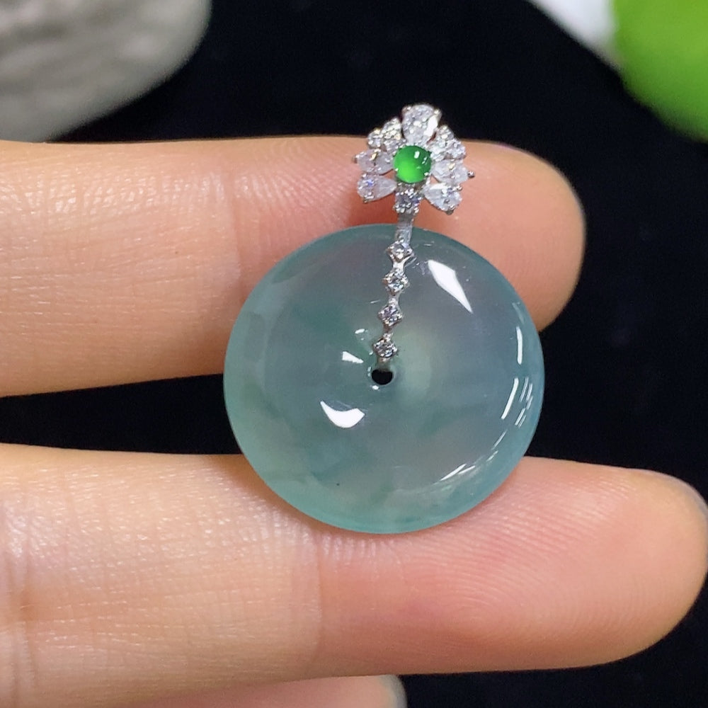 Jadeite pendant with safety buckle on a necklace, featuring 18K non-diamond setting from HKHQ, close-up view of the jewelry.