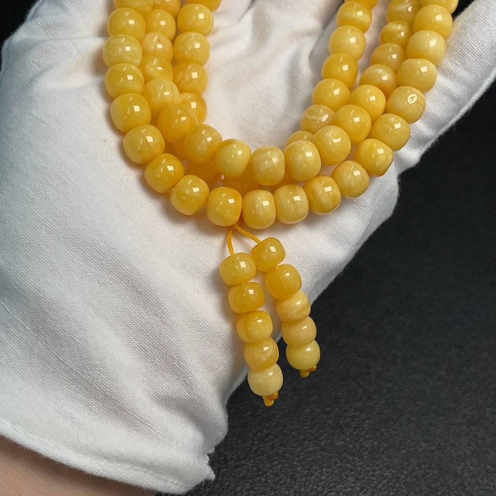 Amber beeswax bead necklace featuring 8.8mm beads, weighing approximately 45.64g, from HUILIU HQ.