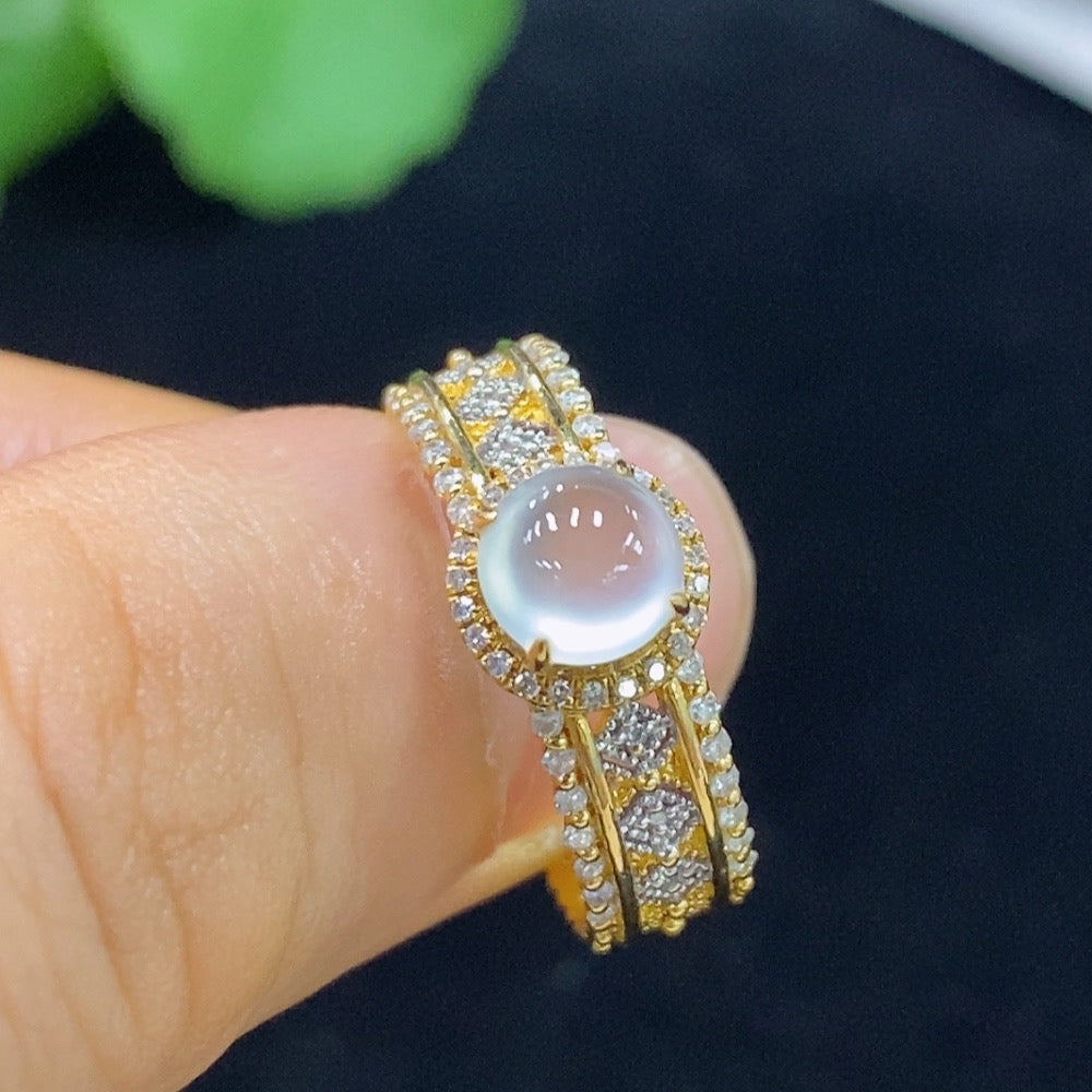HUILIU HQ jadeite cabochon ring with diamond accents, showcasing a polished jade stone set in a silver band.