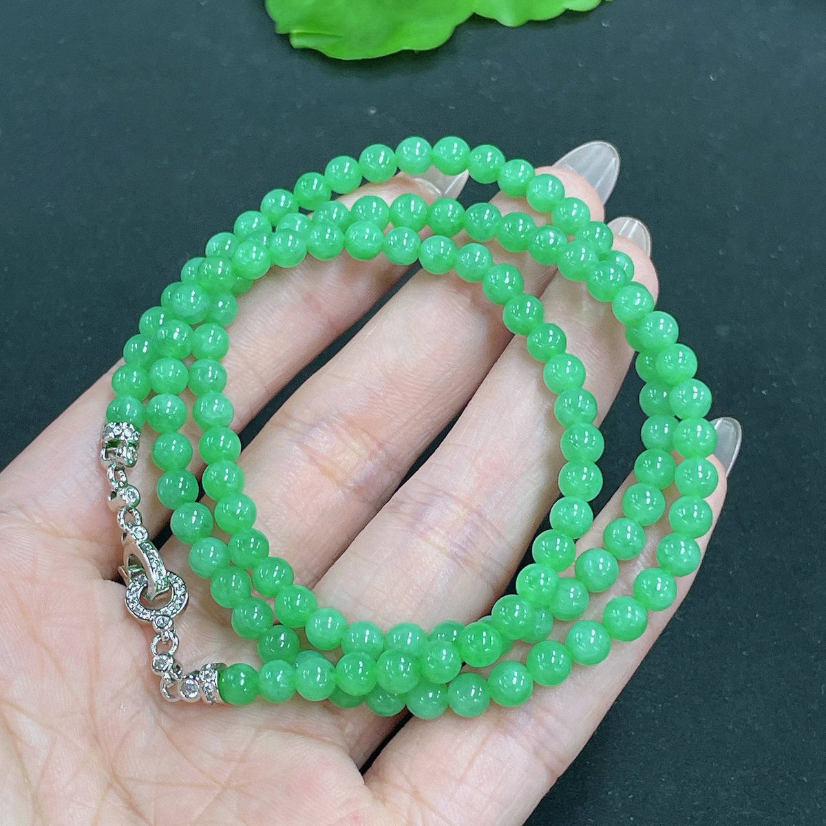 HUILIU HQ jadeite bead necklace with 4.8mm beads, approximately 23.8g, featuring smooth, polished jade stones on a string.