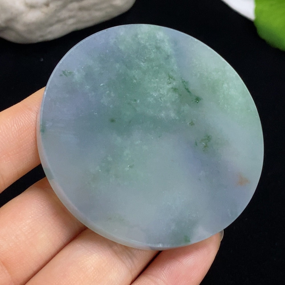Smooth jadeite plain pendant from HKHQ, showcasing a polished, oval-shaped jade pendant with a simple, elegant design.