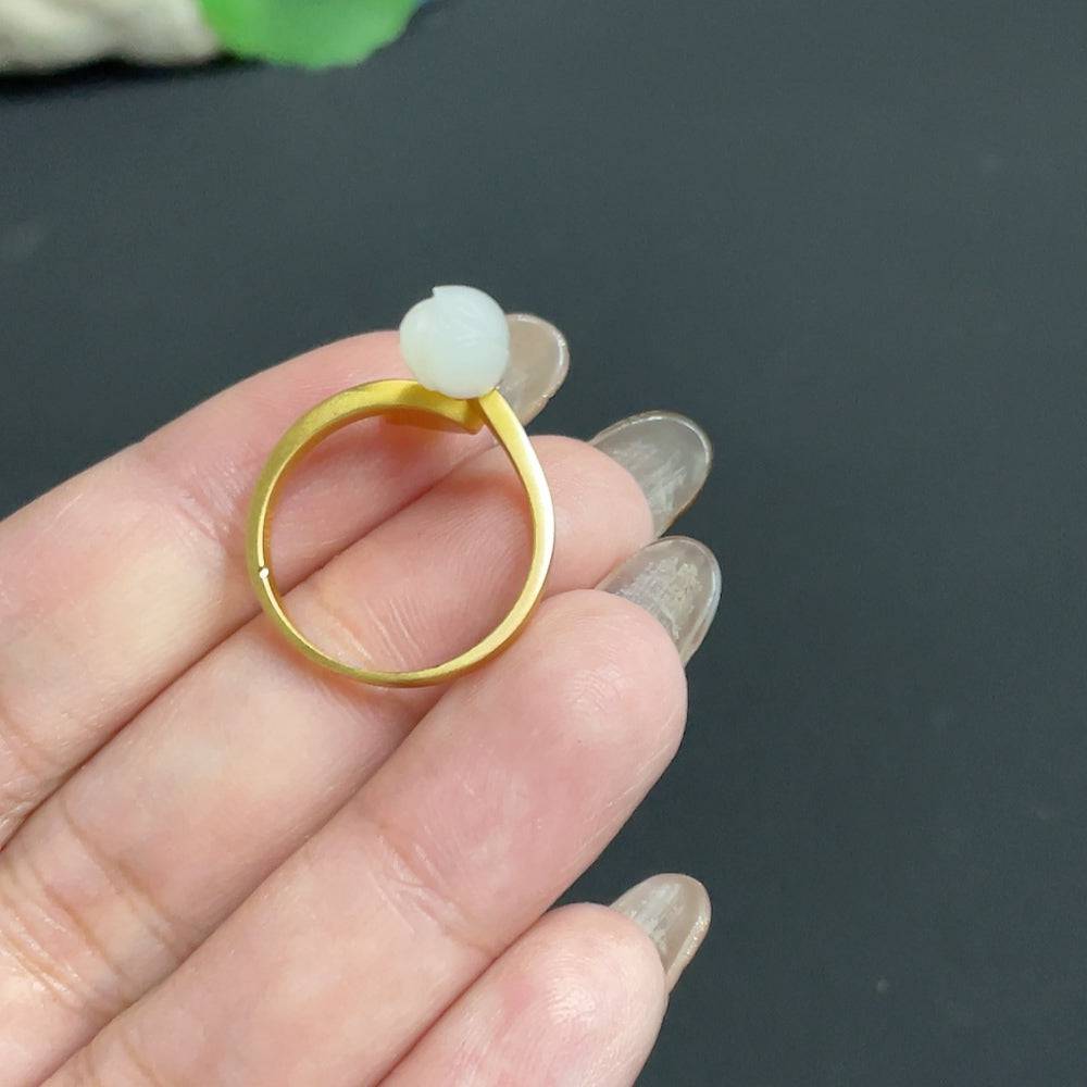 Huiliu Hetian Jade Magnolia Inlay Ring with diamond accents, featuring jade and silver details, on a neutral background.