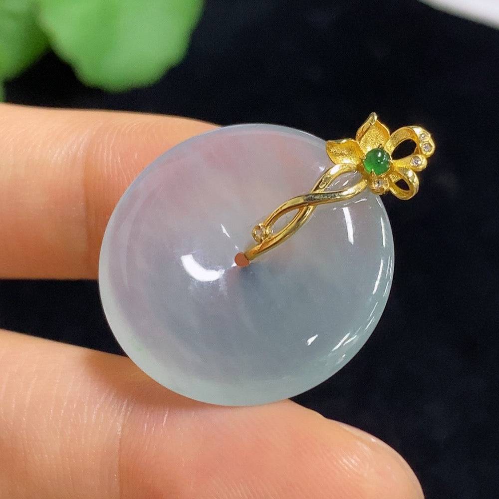 Jadeite peace knot pendant by HUILIU HQ with 18K gold setting, featuring a smooth, polished green jade surface.