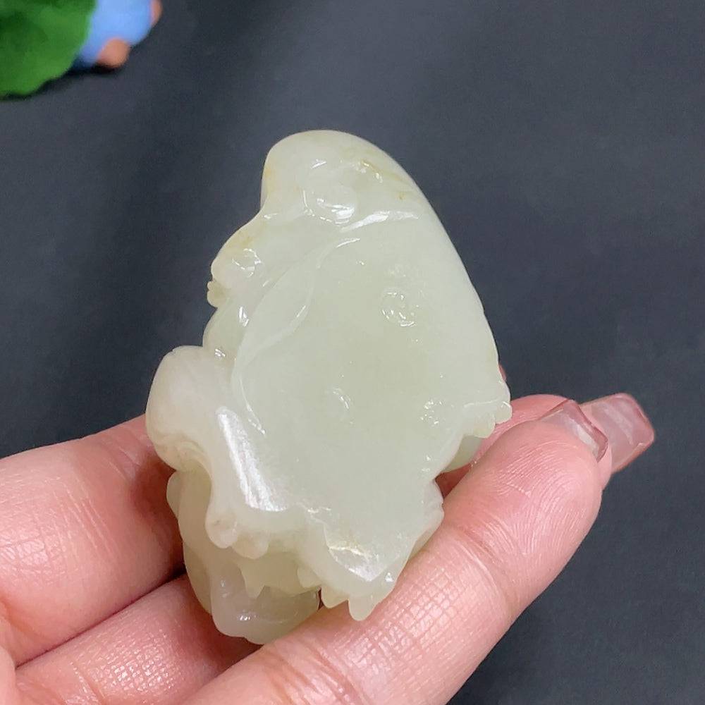 Huiliu certified Hetian jade pendant featuring an auspicious beast design, natural undetermined skin color, handcrafted jewelry.