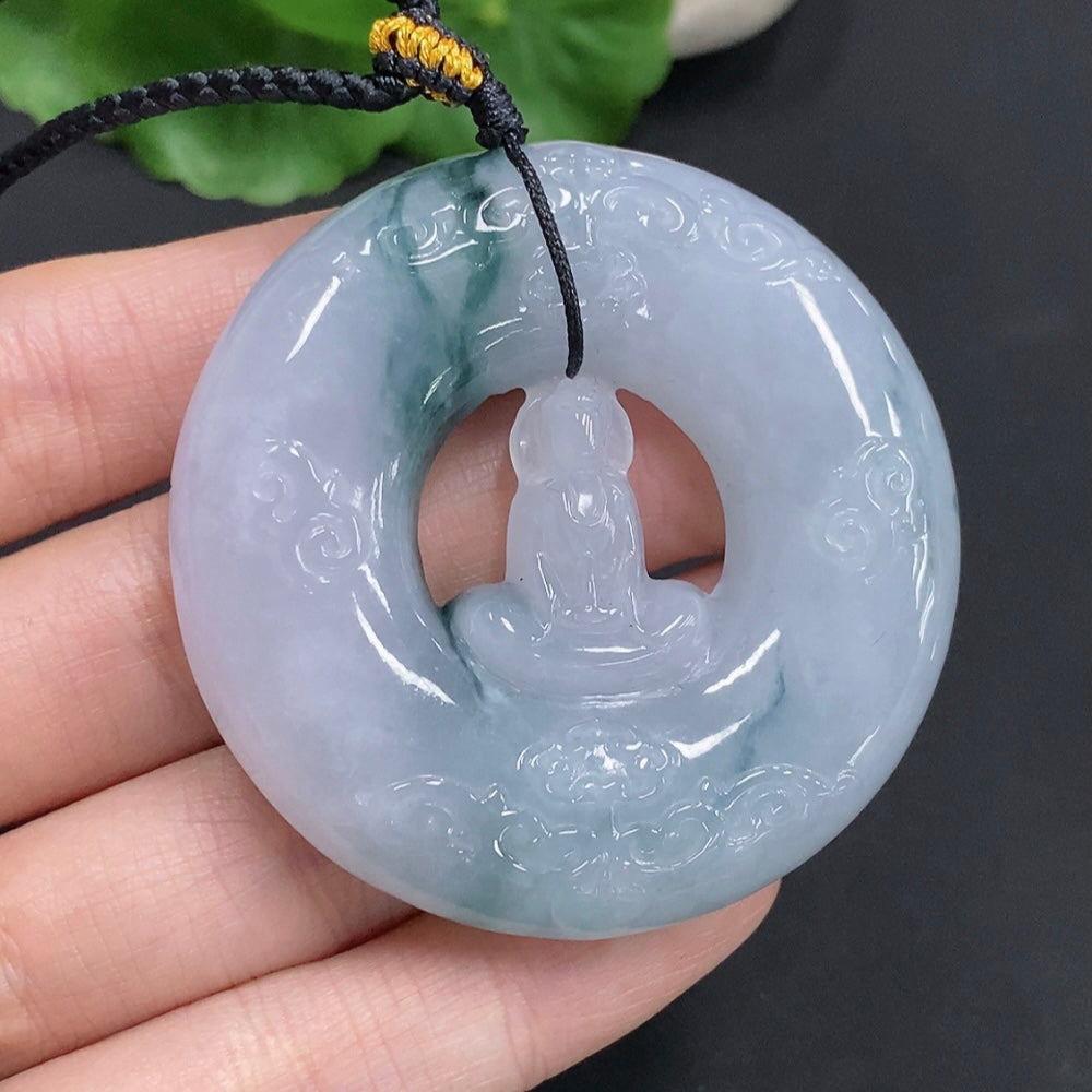 Huiliu Jadeite Enlightenment Pendant featuring a polished, green jade jadeite gemstone with intricate carvings.
