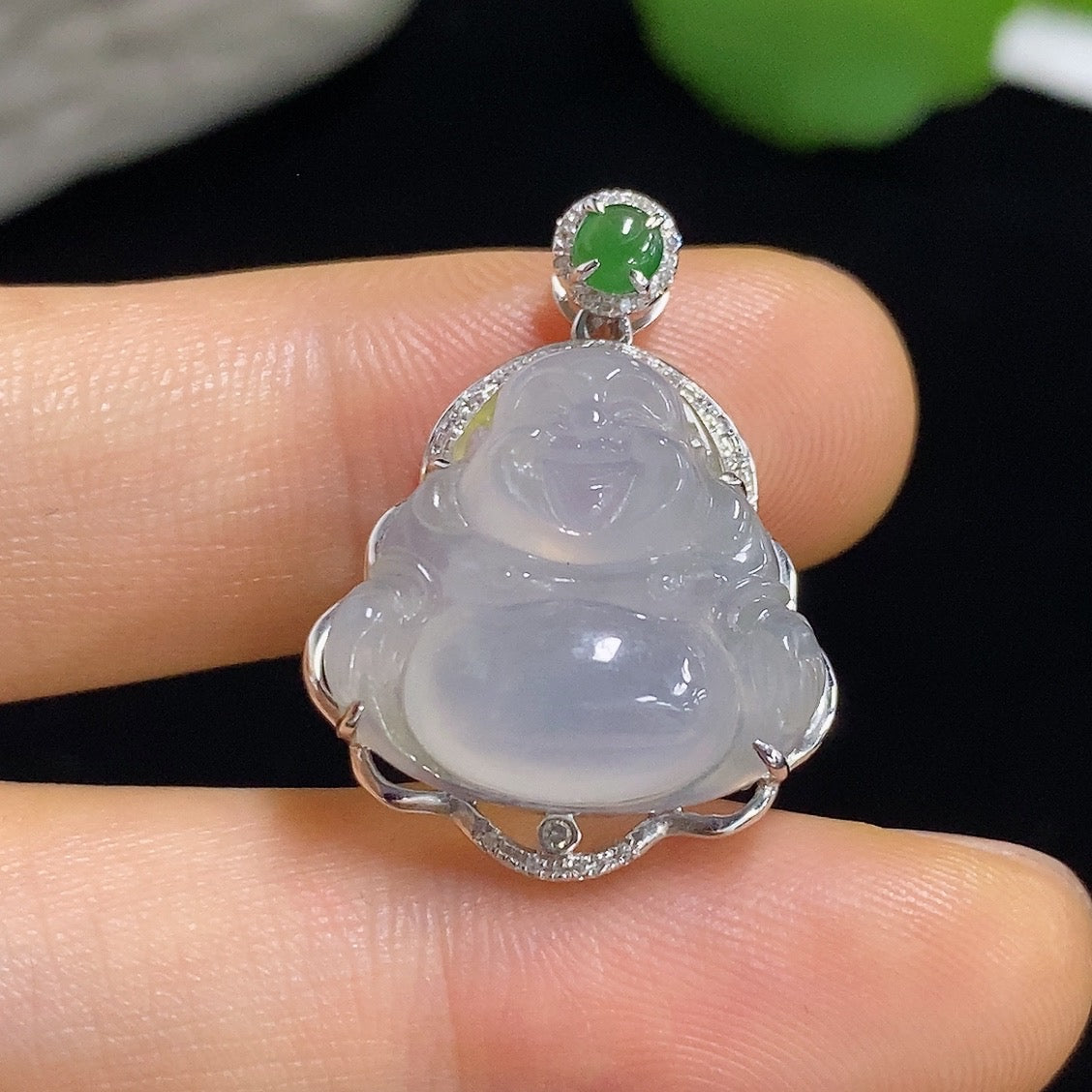 Jadeite Buddha pendant with 18k gold and diamond accents, featuring intricate craftsmanship and a smooth jade surface.