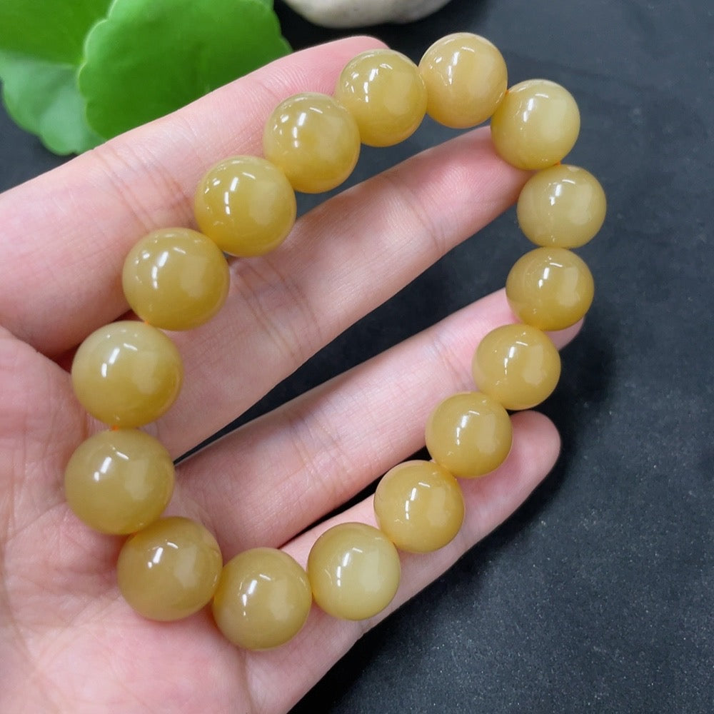 HKHQ Hetian Jade bracelet with 11.8mm beads, weighing approximately 43.1g, featuring smooth, polished green jade stones.