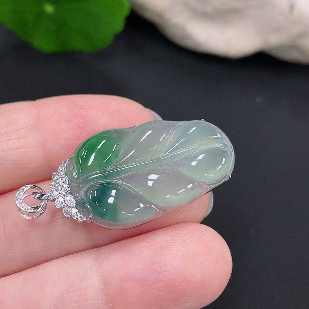 Jadeite pendant leaf by HUILIU HQ with 18k gold accents and diamond details, weighing approximately 4.17 grams.