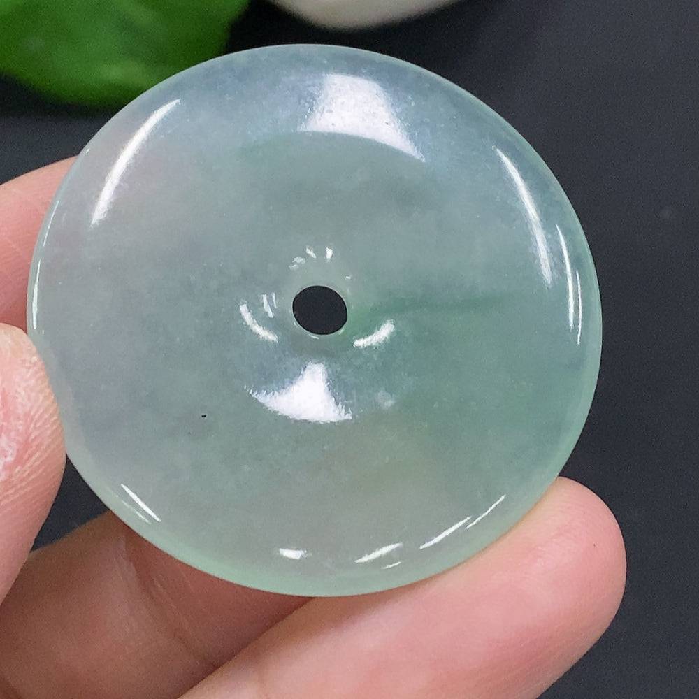HUILIU HQ jadeite Peace Knot pendant weighing 17.4 grams, smooth green jade with intricate knot design, on a plain background.