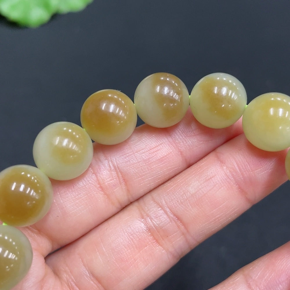 HUILIU HQ Hetian Jade bracelet with 11.9mm stones and a total weight of 41.7g, showcasing smooth polished jade beads.