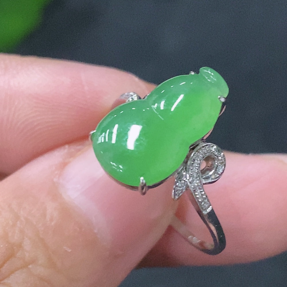 Huiliu jadeite inlaid ring with diamond accents, showcasing intricate craftsmanship and elegant design in a close-up shot.