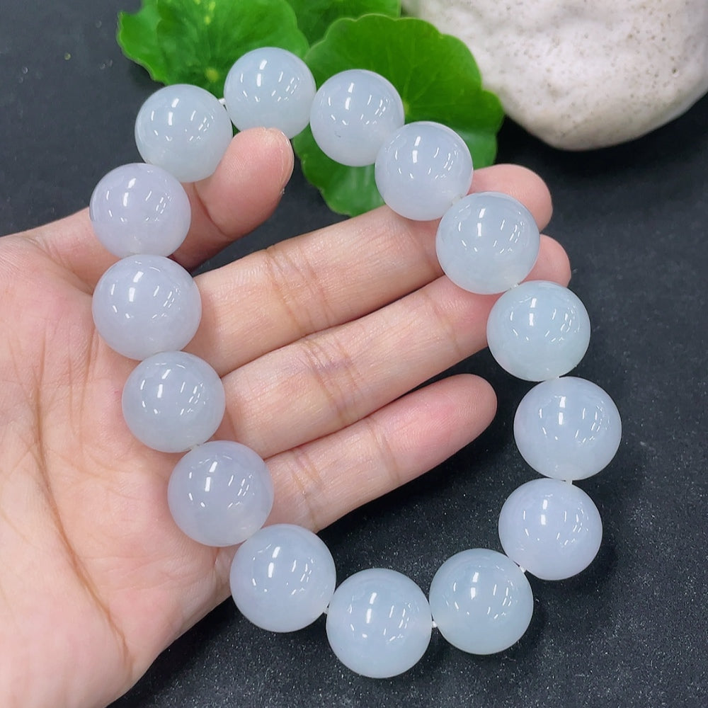HKHQ jadeite bracelet with 15.4mm smooth, polished jadeite beads arranged in a stylish bracelet design.