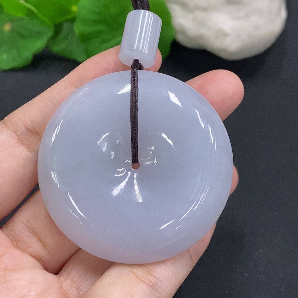Jadeite Peace Knot pendant from HUILIU HQ, weighing around 56.5g, showcasing smooth green jade with intricate knot design.
