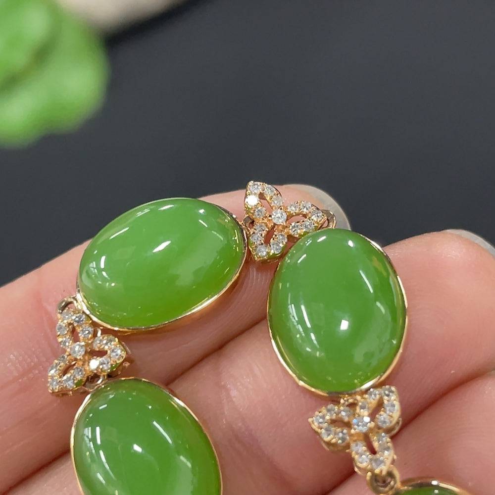 Huiliu certified Hetian jade cabochon inlay bracelet with diamond accents, featuring suspected plated areas marked in red.