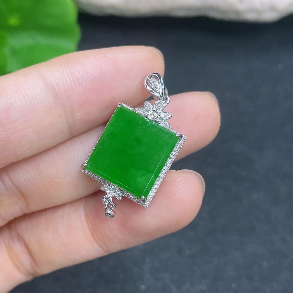 Jadeite pendant with 18k gold and diamond accents, elegant necklace featuring a polished jadeite stone and detailed gold setting.