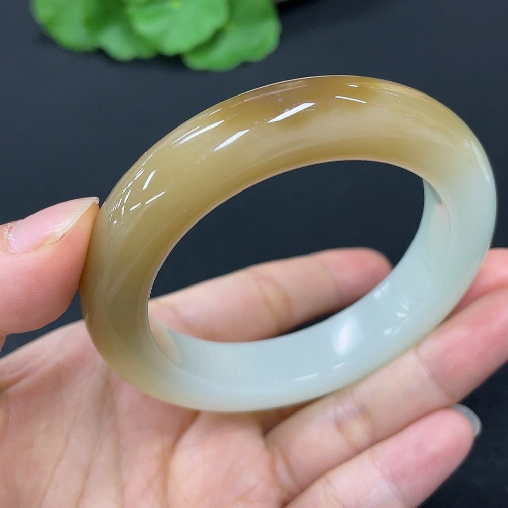 Hetian jade round bangle bracelet by HKHQ, size 51.3, polished smooth surface, showcasing elegant jade craftsmanship.