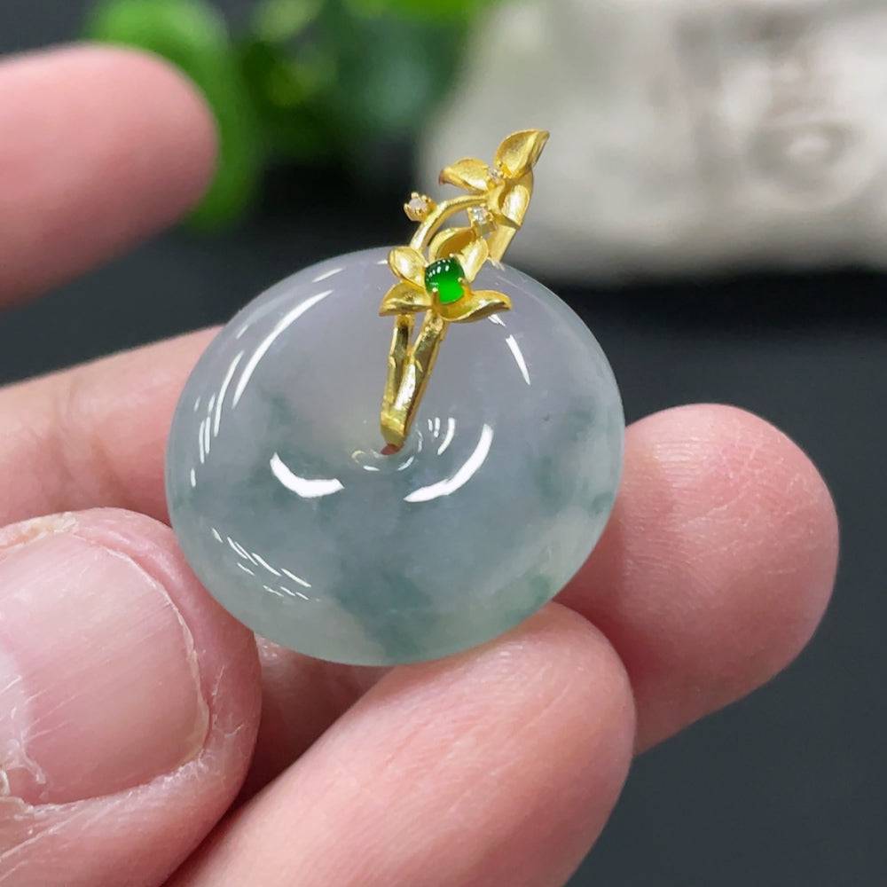 Jadeite safety pendant with 18k gold clasp, showcasing smooth green jade stone and elegant gold details.