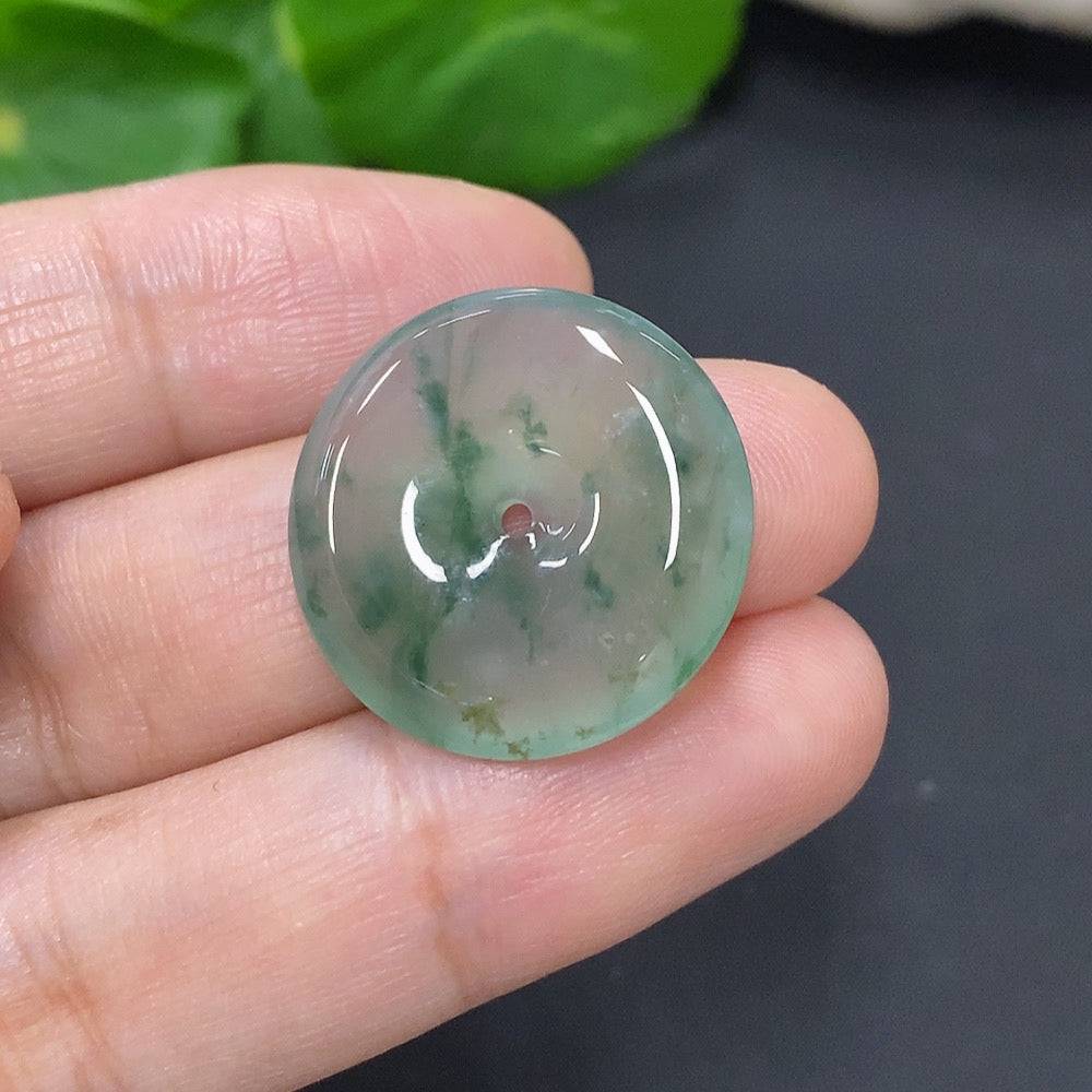 Jadeite Peace Knot pendant in green jade, approximately 4.2g, crafted by HUILIU HQ, showing intricate knot design and smooth surface.