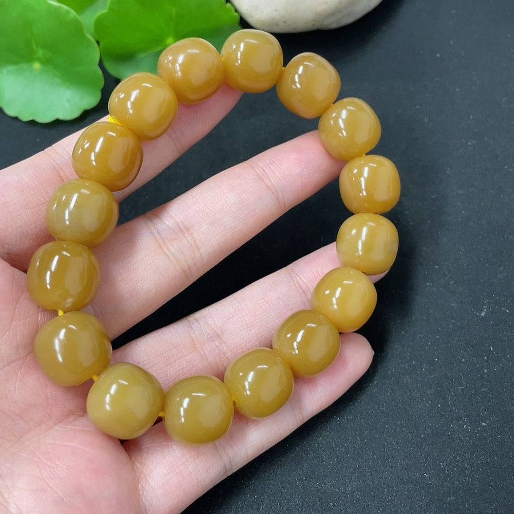 Hetian jade bracelet by HKHQ featuring smooth, polished jade beads in a natural green hue, weight 58.5g, designed for elegant wear.
