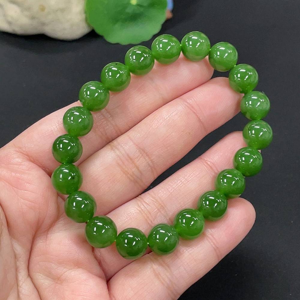 Hetian jade bracelet by HUILIU HQ featuring 9.5mm smooth jade beads, total weight approximately 28.6 grams.