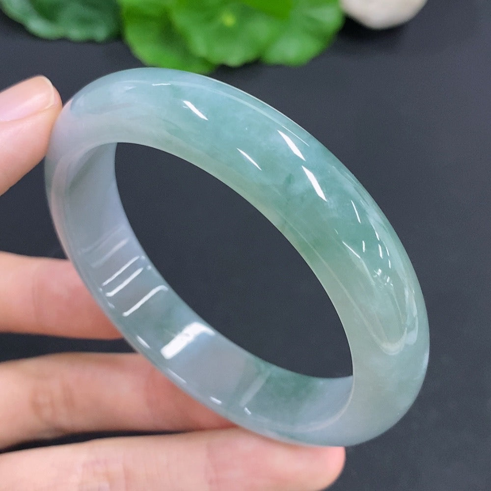 Jadeite round bracelet by HKHQ, weighing approximately 56.4g, featuring smooth green jade beads on a flexible string.