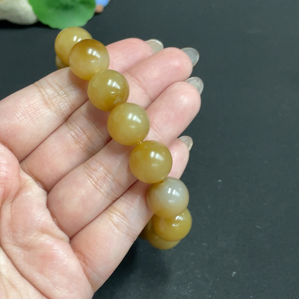 HUILIU HQ Hetian jade bracelet with 13.9mm beads, weighing approximately 65.4g, showcasing smooth, polished jade stones.
