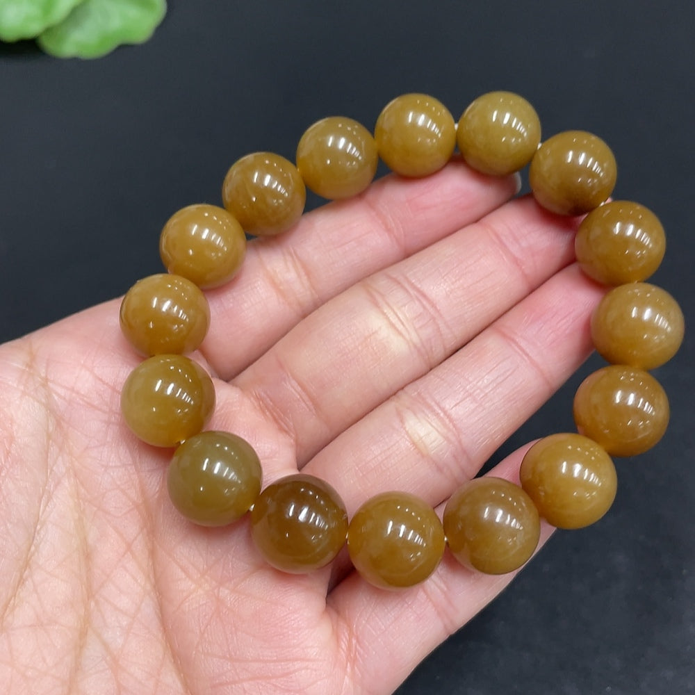 Hetian jade bracelet with 11.6mm beads, weighing approximately 42g, crafted by HUILIU HQ, featuring smooth, polished jade stones.