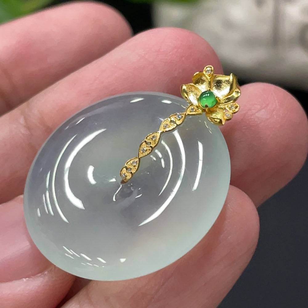 Jadeite safety pendant with 18K gold bail and diamond accents, weighing approximately 6.87g, from HUILIU HQ.