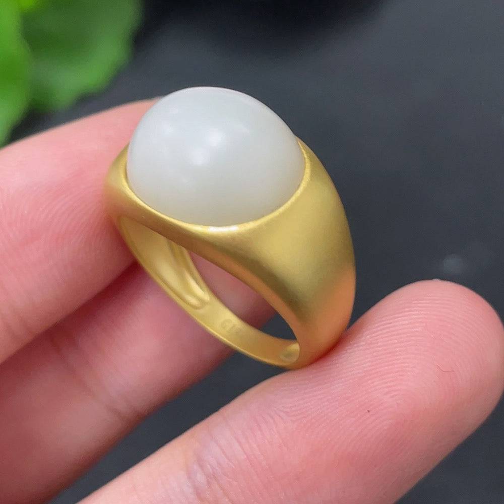 Huiliu certified Hetian jade inlaid ring featuring intricate jade craftsmanship and elegant design on a silver band.