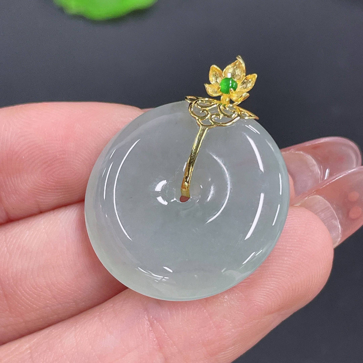 Huiliu Jadeite Peace Knot Pendant, certified jade jewelry with intricate knot design, displayed against a neutral background.