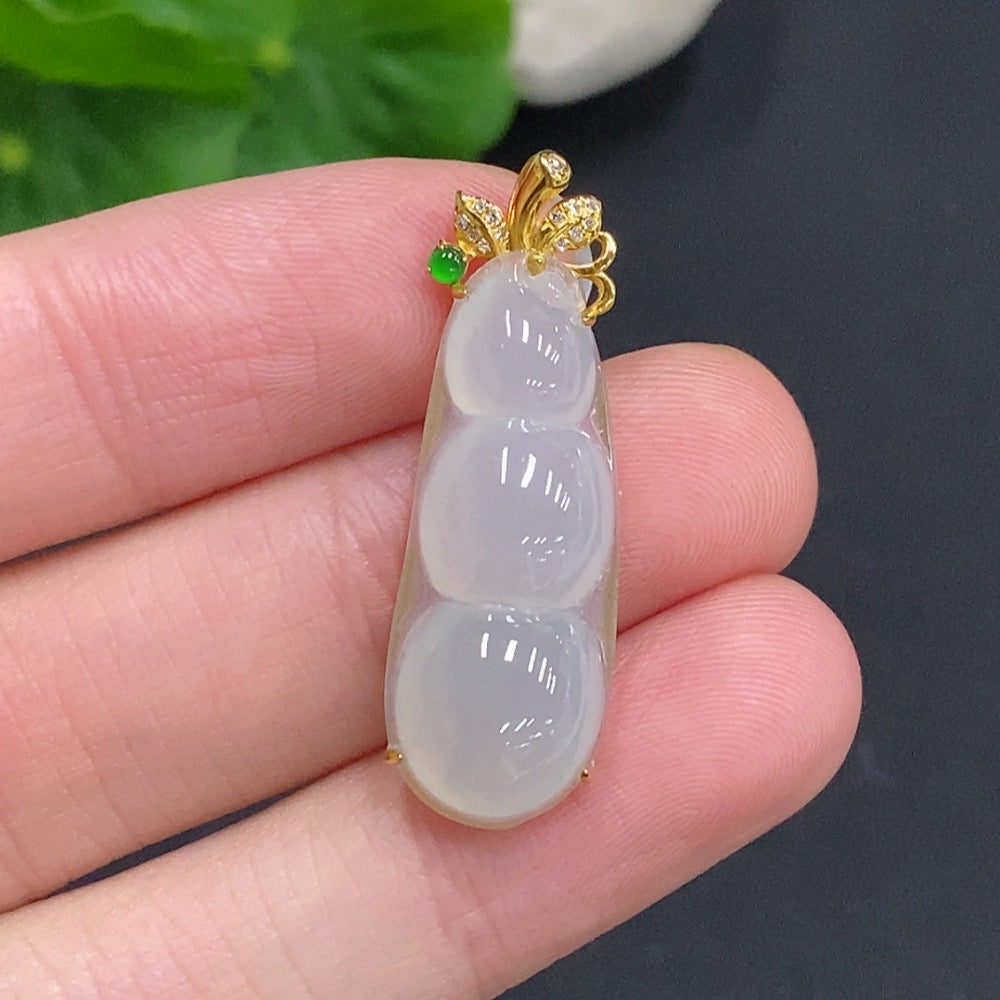 Huiliu Jadeite Lucky Bean Pendant with diamond accents, crafted from green jade, featuring a polished, natural stone design.