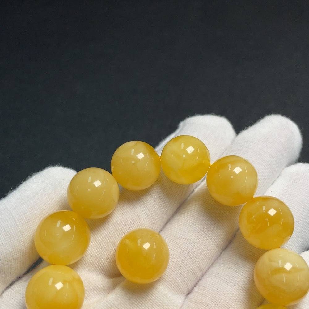 Amber Beeswax bracelet with loose beads, about 14.6mm, crafted by HUILIU HQ, showcasing natural amber jewelry and beads.