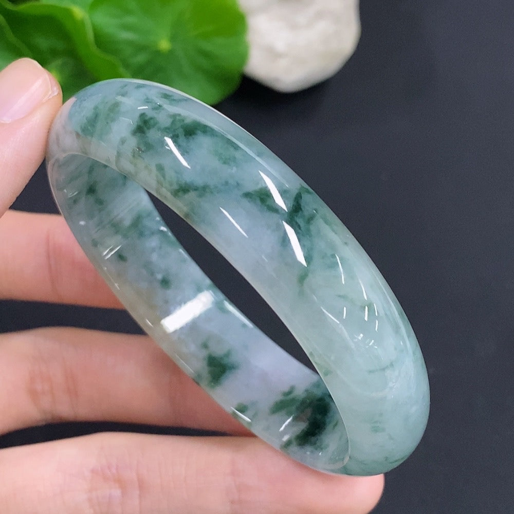 HKHQ Jadeite oval bangle in size 58.8, weighing 47.7g, featuring a smooth, polished green jadeite bracelet with an elegant oval shape.