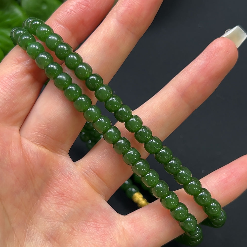 HKHQ Hetian Jade bead necklace with 6.2mm non-gold beads, showcasing smooth, round jade stones on a sleek string.