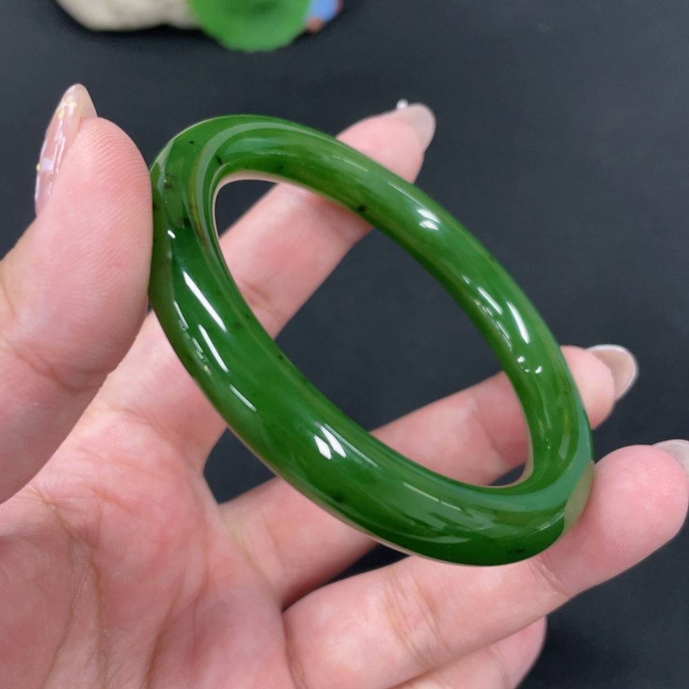 Huiliu certified Hetian jade round bangle with smooth polished surface and natural jade color, traditional jewelry accessory.