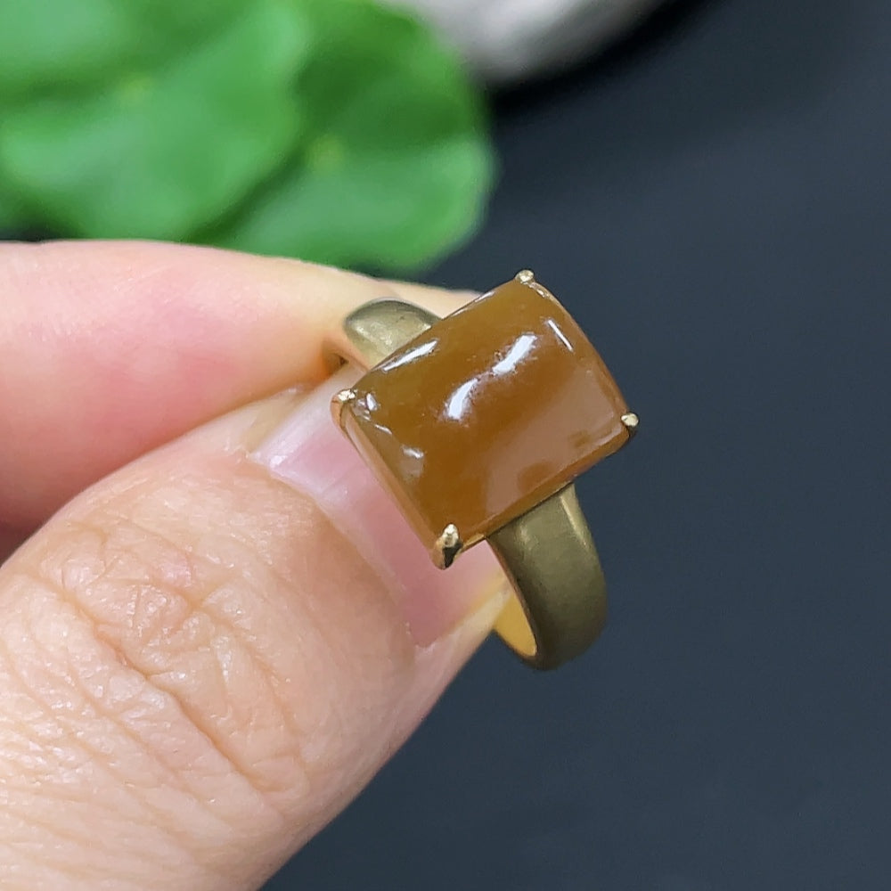 Hetian jade ring with 18K gold band, adjustable, showcasing smooth jade gemstone and elegant gold setting.